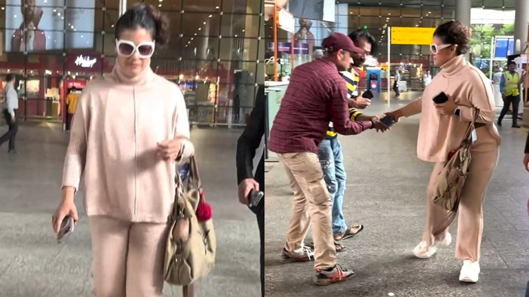 Kajol-helps-paparazzo-who-fell-down-at-the-airport-WATCH.jpg